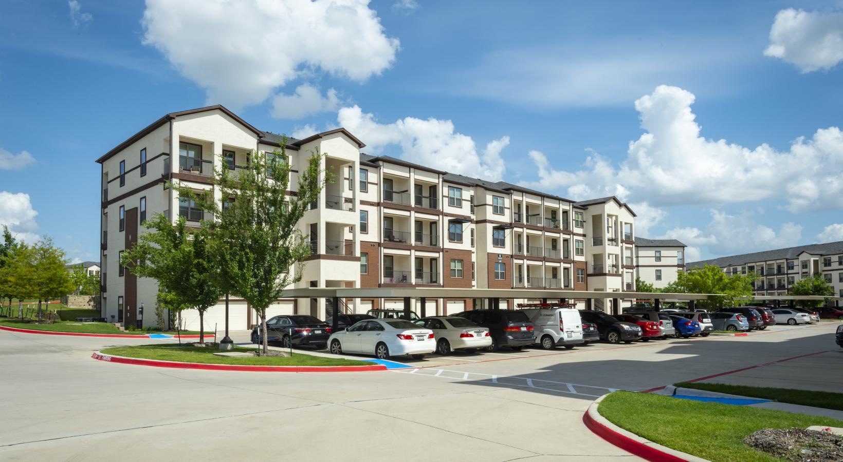 The essence of exceptional living a parking lot in front of a building