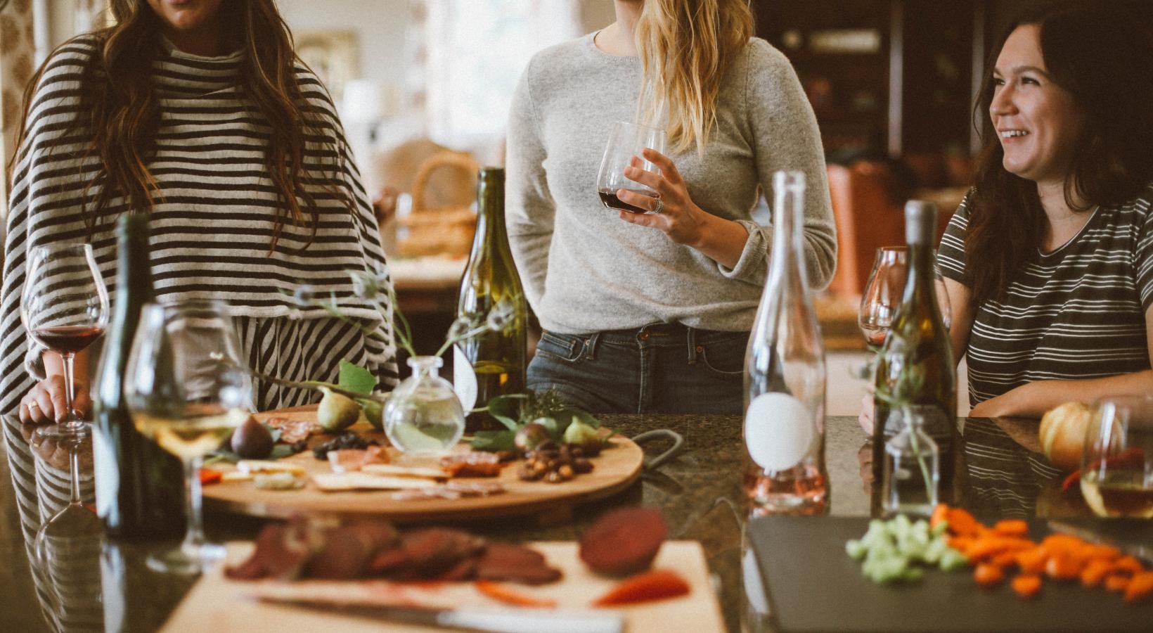 Bustling community with plenty of dining choices a group of women stand around a table with food