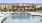 a pool with a building in the background
