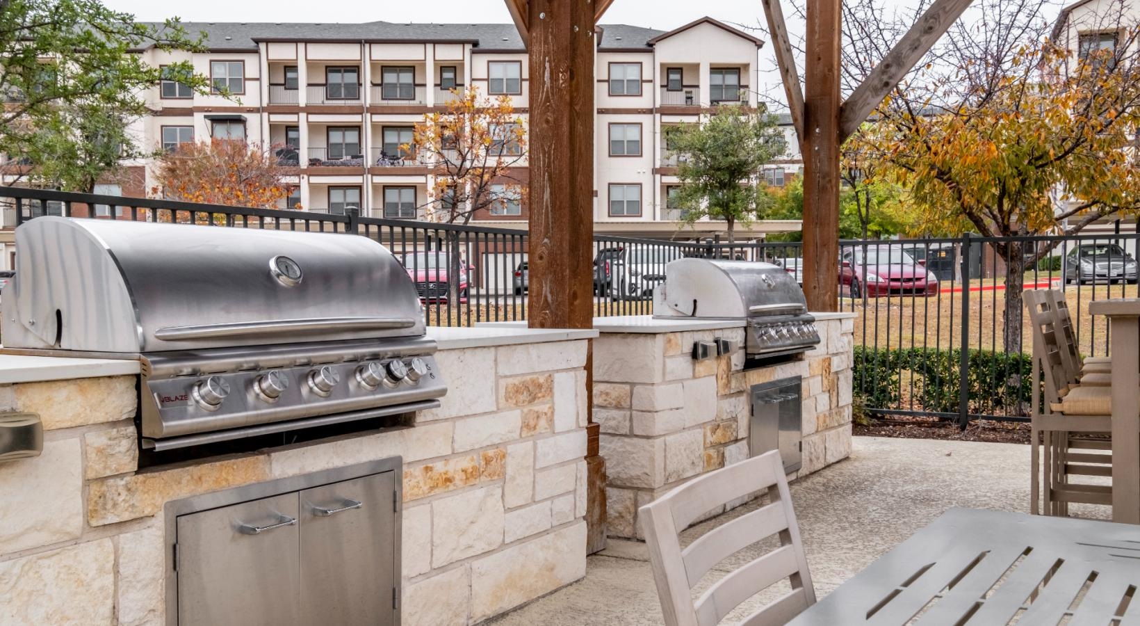Settle into comfort at Berkshire Preserve a patio with chairs and a table