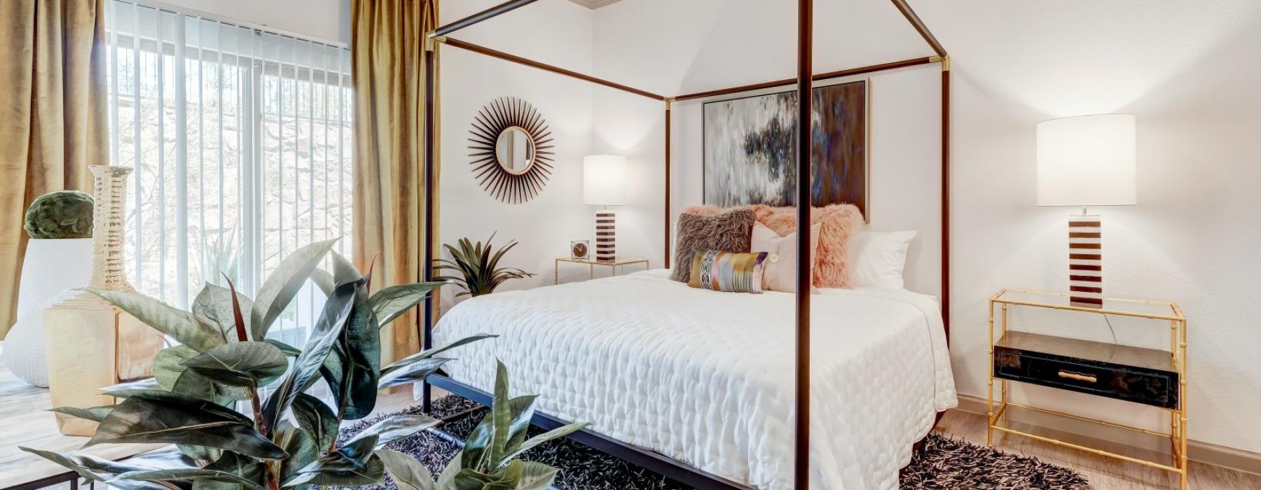 a bedroom with a bed and a mirror