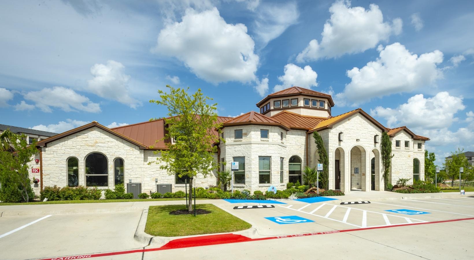 Settle into comfort at Berkshire Preserve a large building with a parking lot