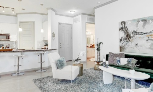 a living room with a large painting