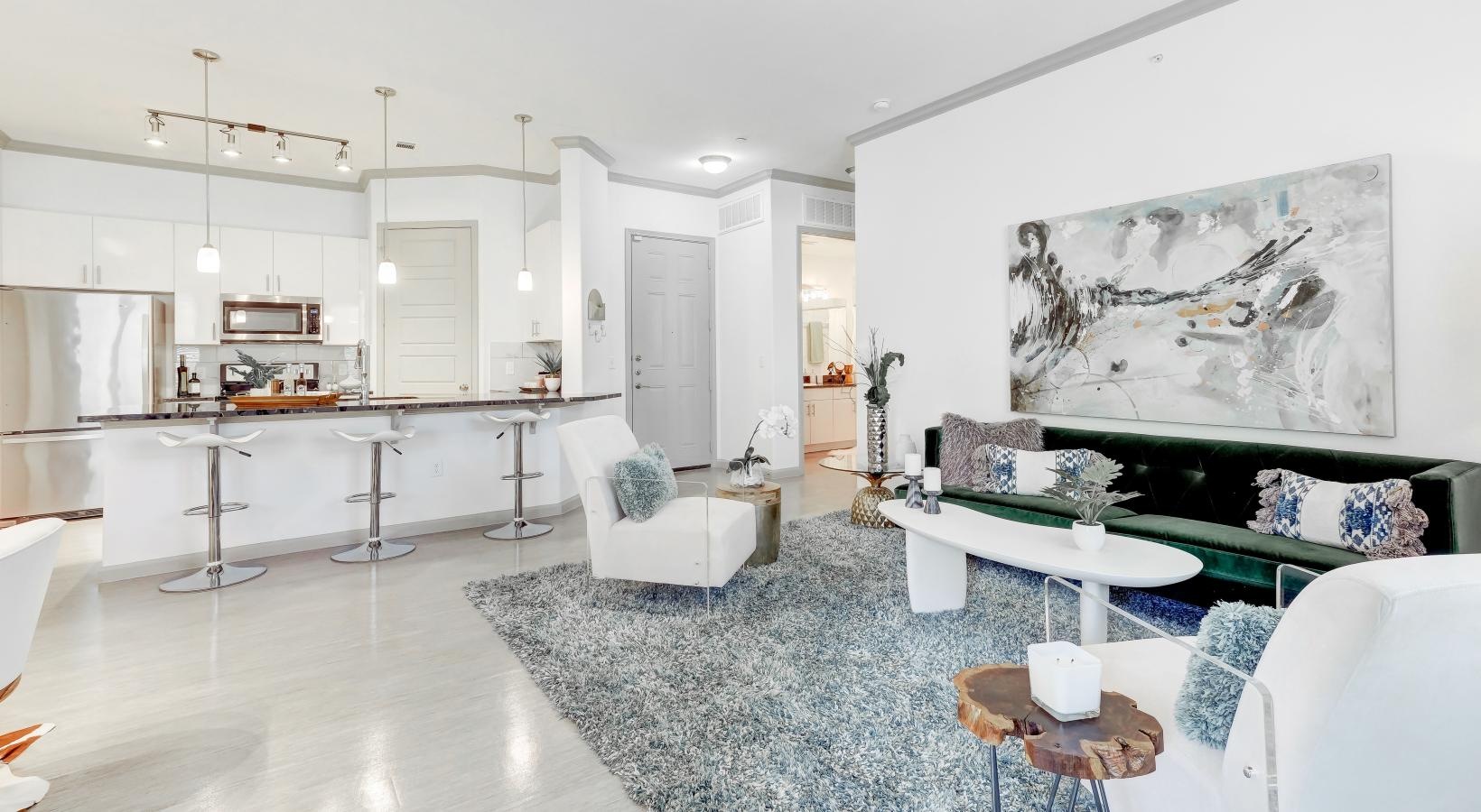 Wide open living areas perfect for entertaining a living room with a large painting