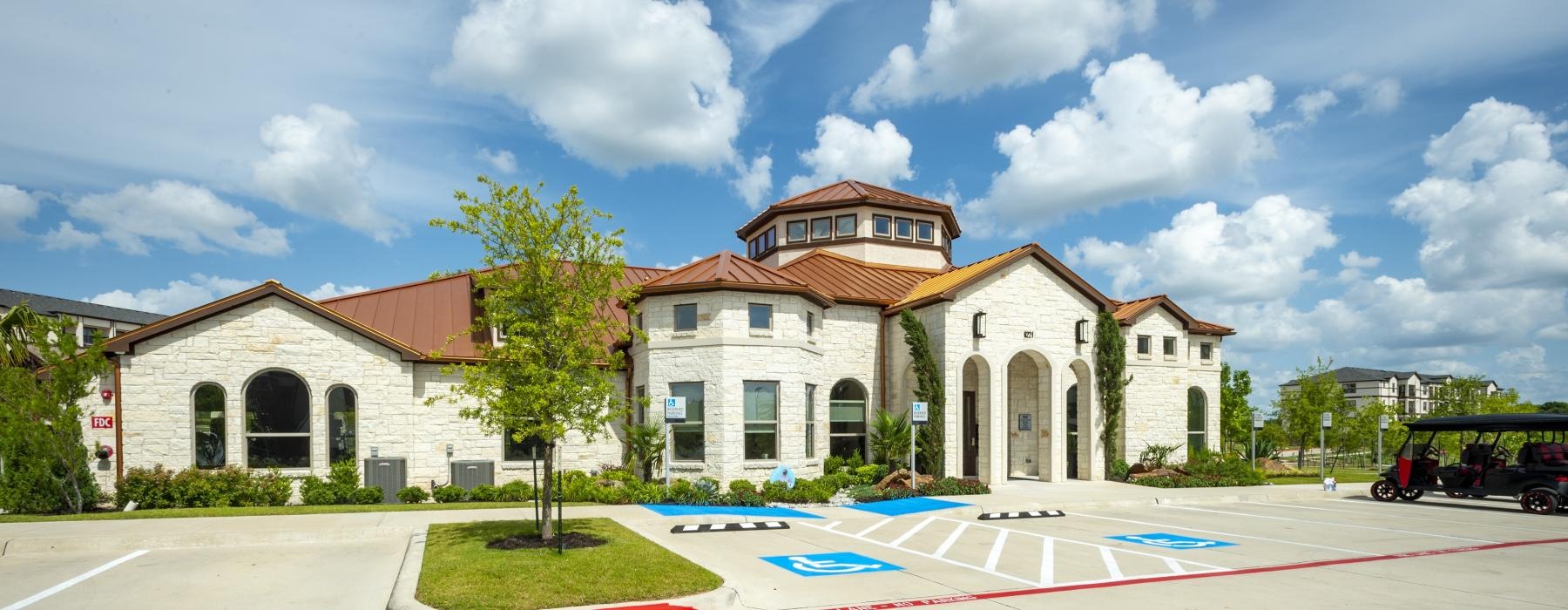 a large building with a parking lot