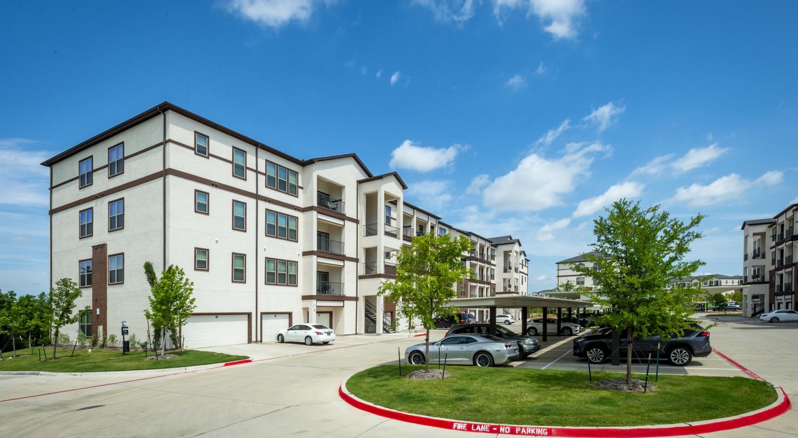 The essence of exceptional living a building with cars parked in front
