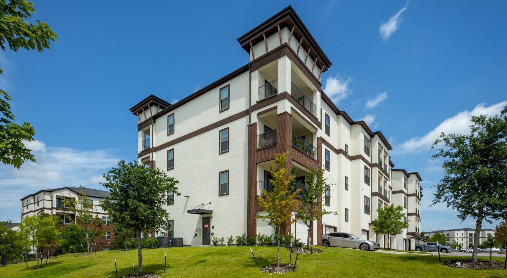 Settle into comfort at Berkshire Preserve a large building with trees in front of it